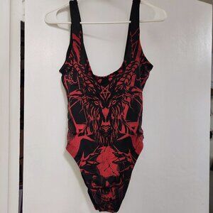One-piece swimsuit with demon face in red and black. Size Medium. NWT
